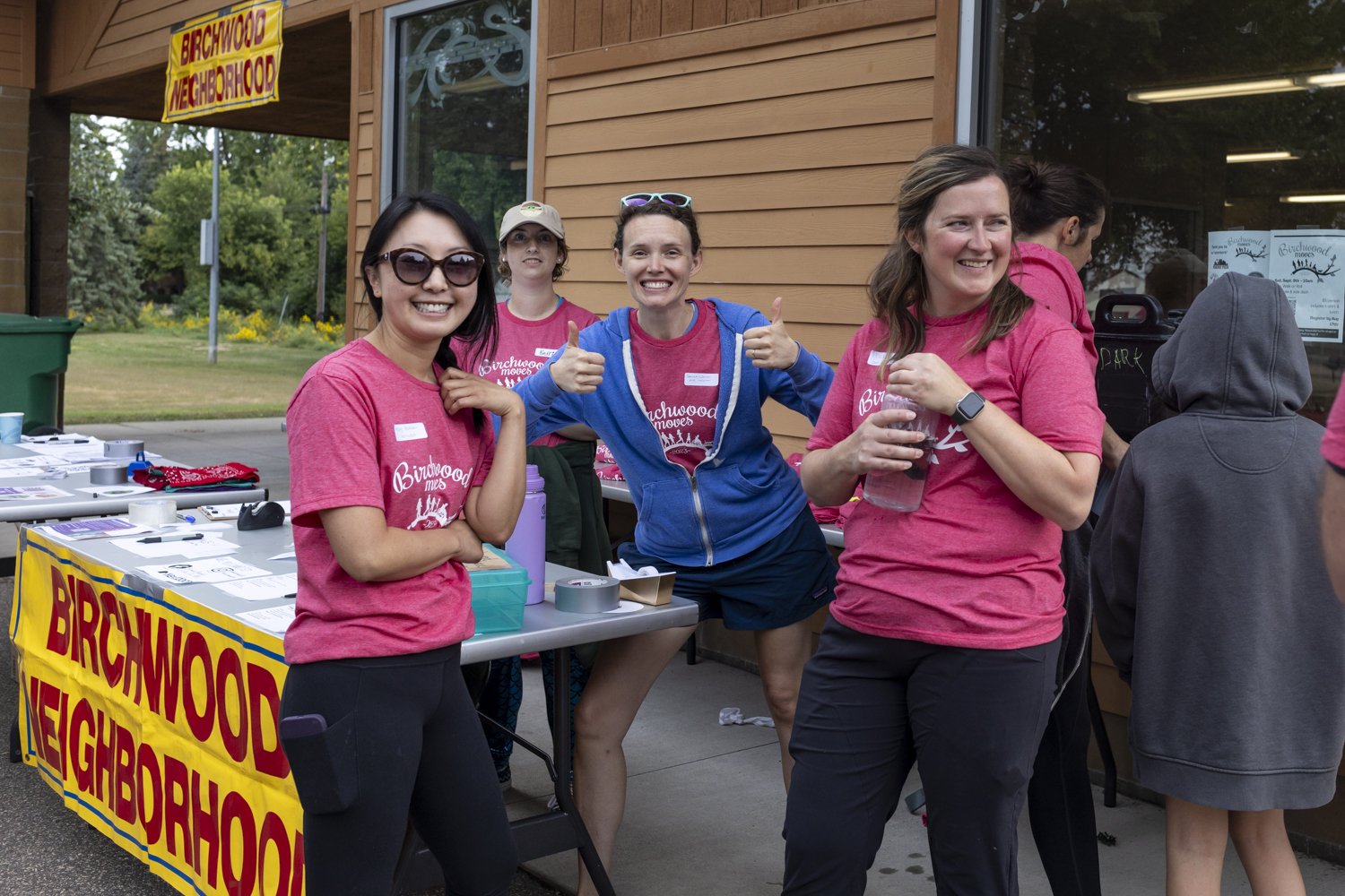 Group of people at Birchwood Neighborhood event table