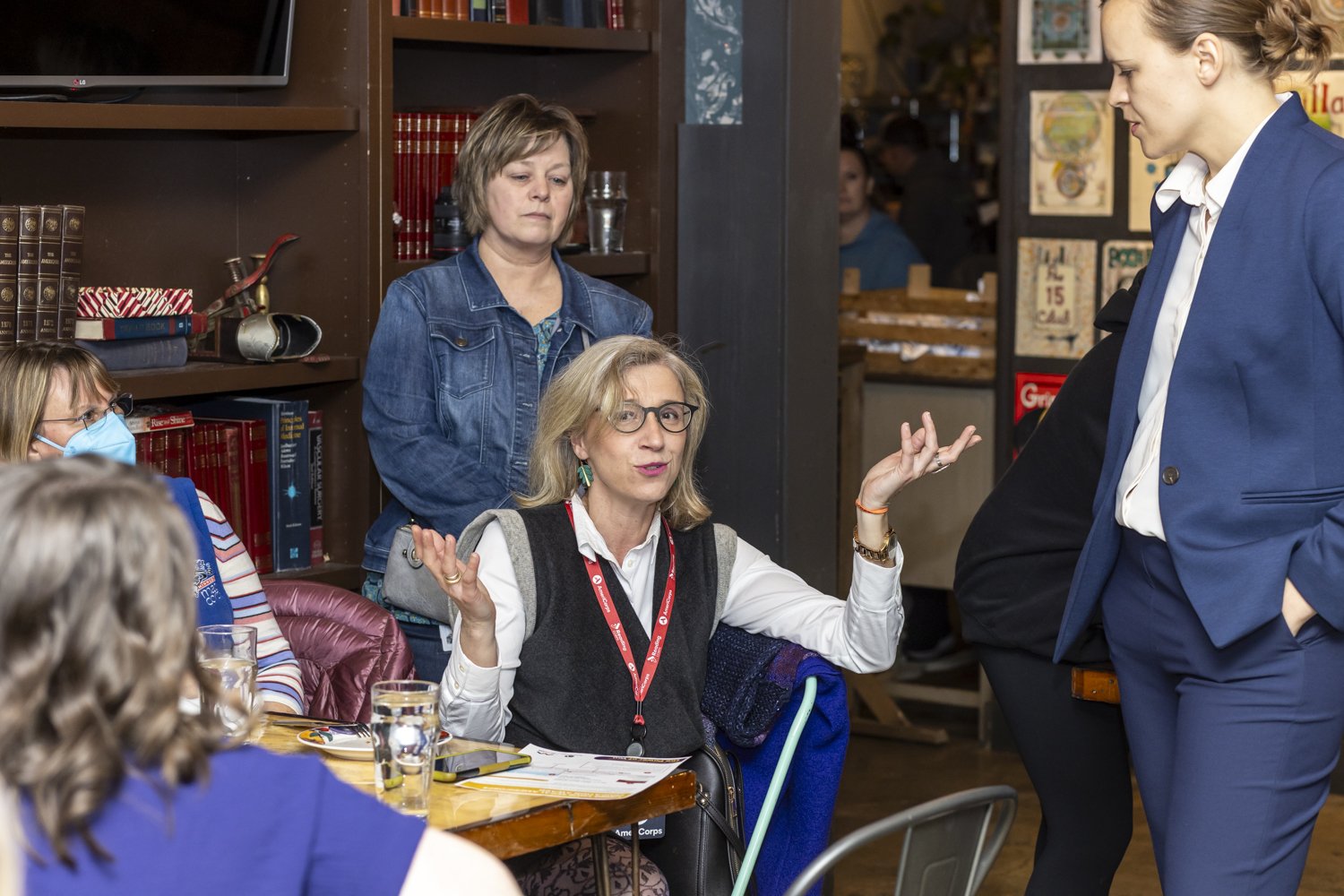 Group of women having a discussion in a library setting
